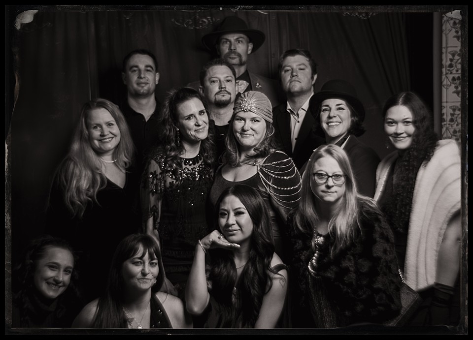 murder mystery party tintype photobooth large group photo of 13 people
