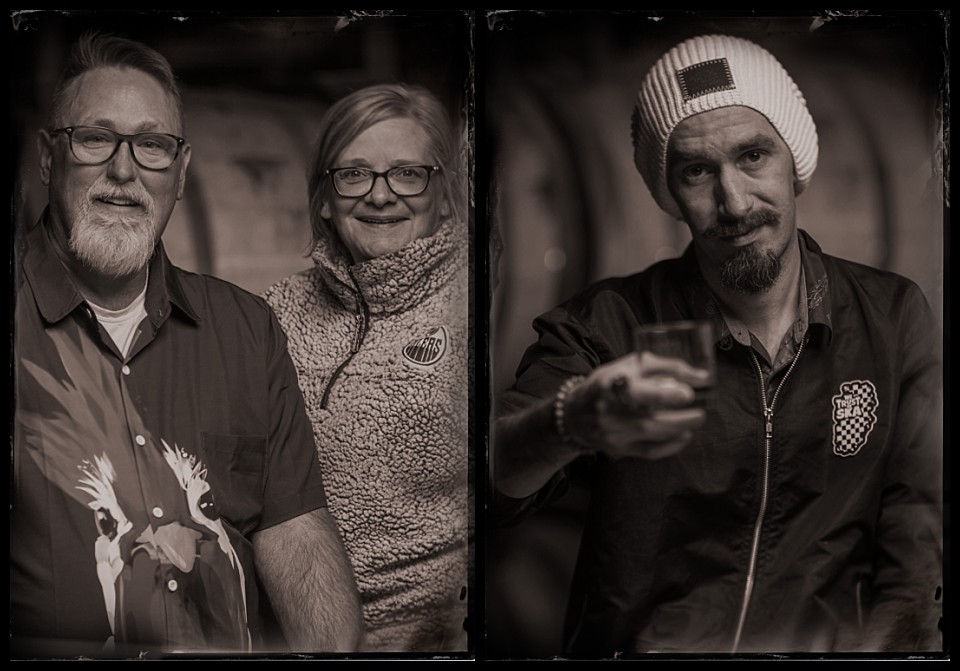 laws whiskey house gargoyles party tintypes portrait of man cheers to the camera