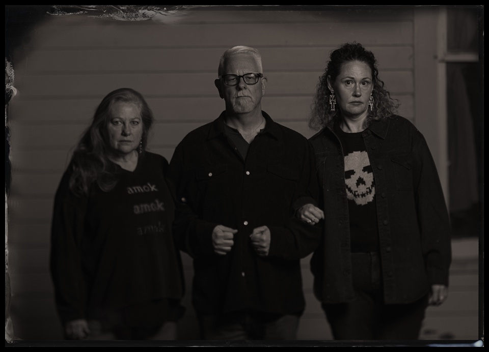 spirits and spirits tintype photobooth throuple outside schoolhouse