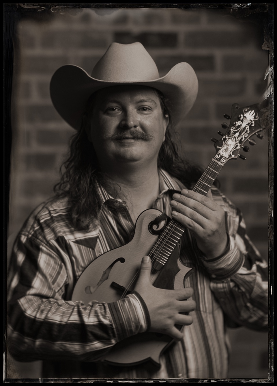 tintype photobooth wild west winterfest musician with mandolin