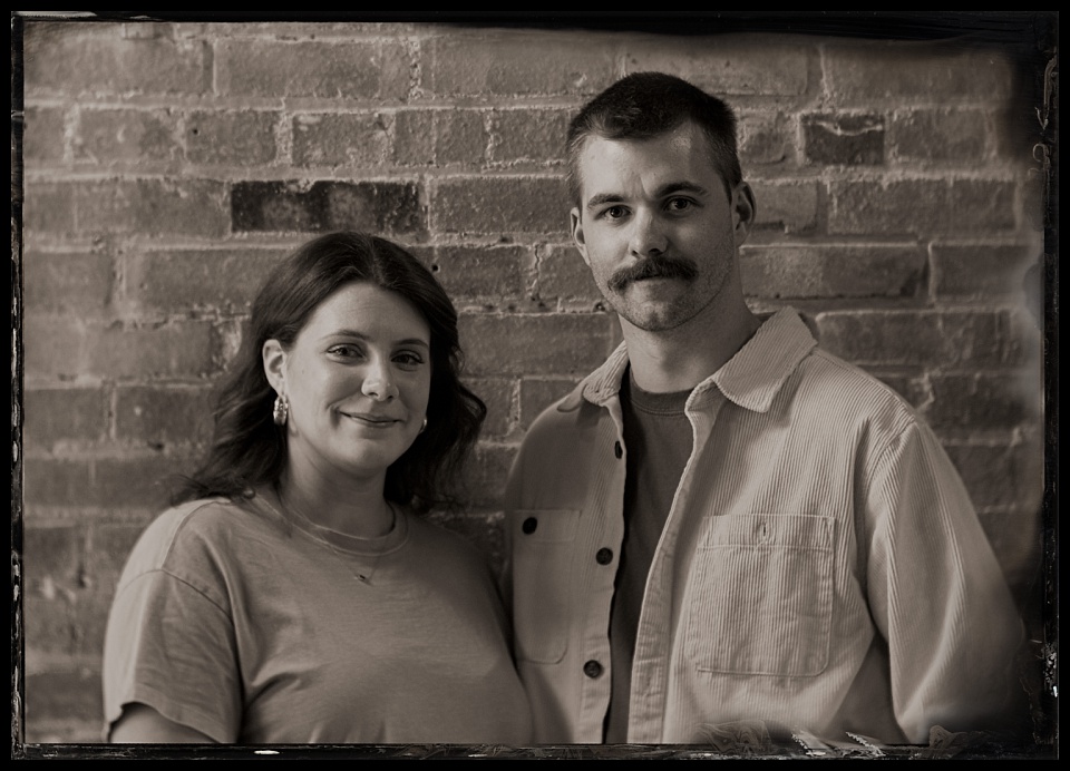 tintype photobooth wild west winterfest couple near brick wall