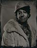 tintype portrait of a woman wearing vintage clothes and hat